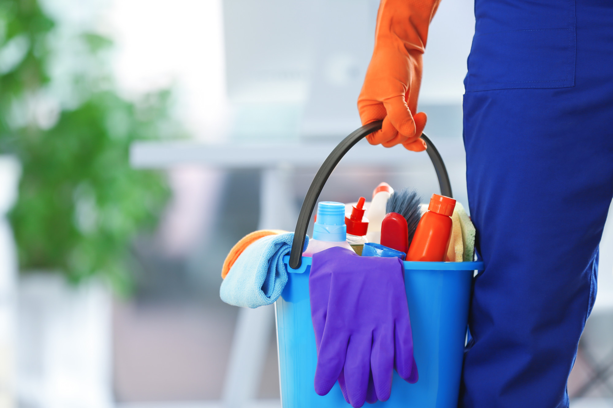 holding cleaning products and tools on bucket, close up holding cleaning products and tools on bucket, close up